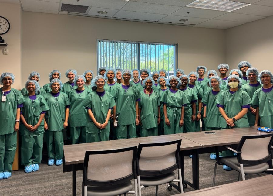 HonorHealth 2025 teen volunteers pose for group photo in scrubs.