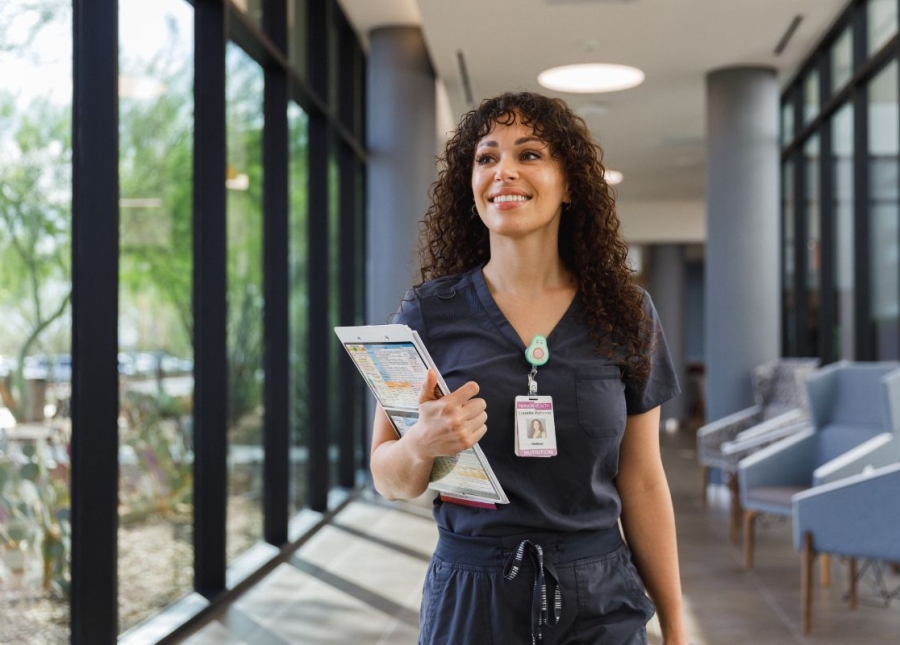 HonorHealth Careers - Lisette Mahoney, RDN, smiles while walking through HonorHealth halls.