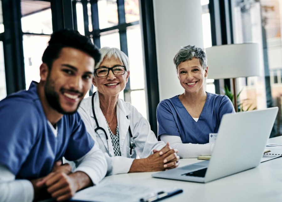 Smiling HonorHealth physicians smile for group photo.
