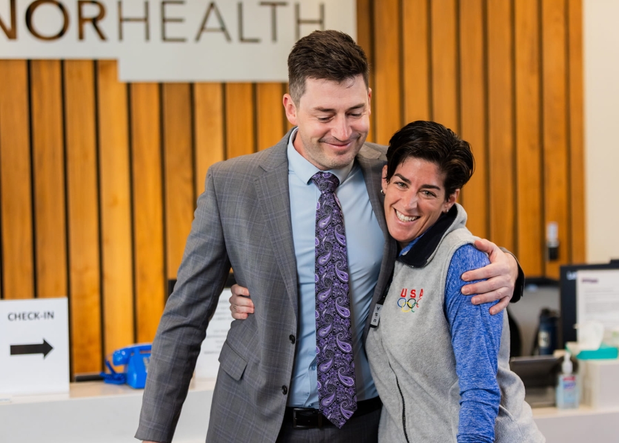 Two HonorHealth physician and APP employees embrace.