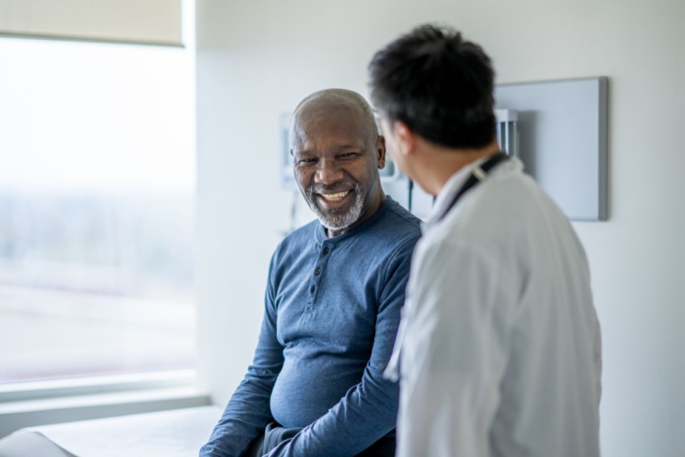 After using HonorHealth’s open access model, a smiling patient sits with a trusted provider at a scheduled appointment for the same or next day.  