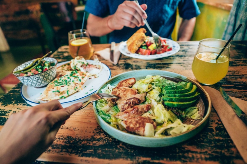 HonorHealth Bariatrics - Two people sit at a table with various protein sources 