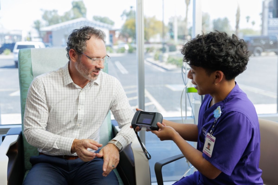 HonorHealth Executive Health - Provider explains health results to male patient during appointment.