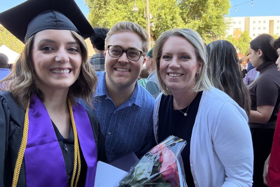 HonorHealth employee smiles with family, graduating from GCU with the help of HonorHealth Careers tuition benefit.