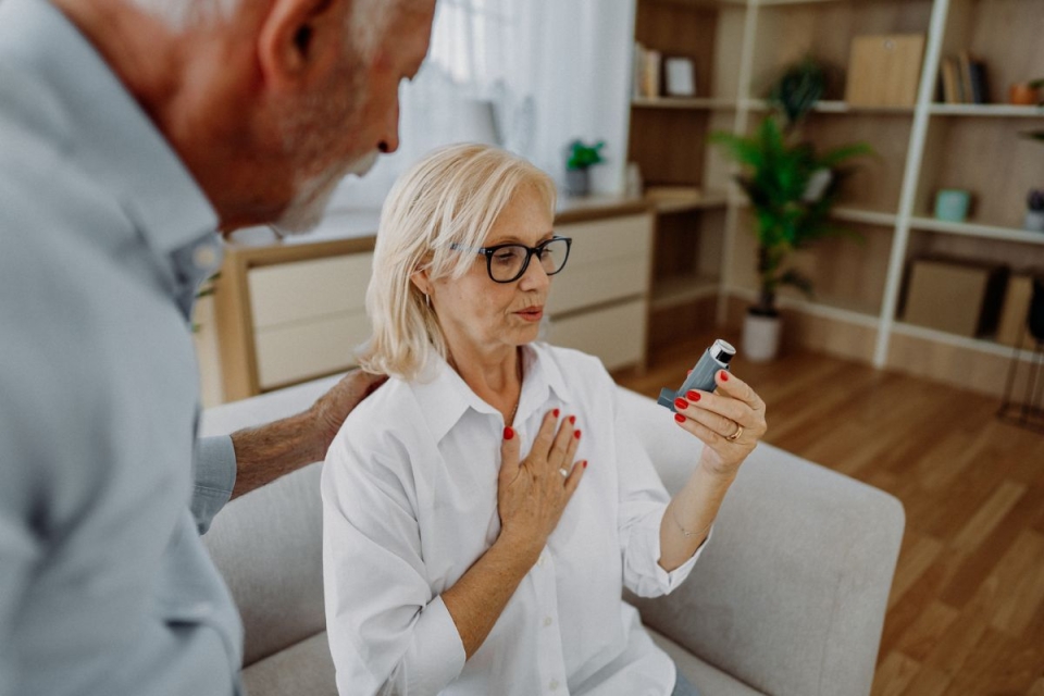 HonorHealth Heart Care - Woman with asthma and COPD uses inhaler for shortness of breath due to poor air quality in the summer.