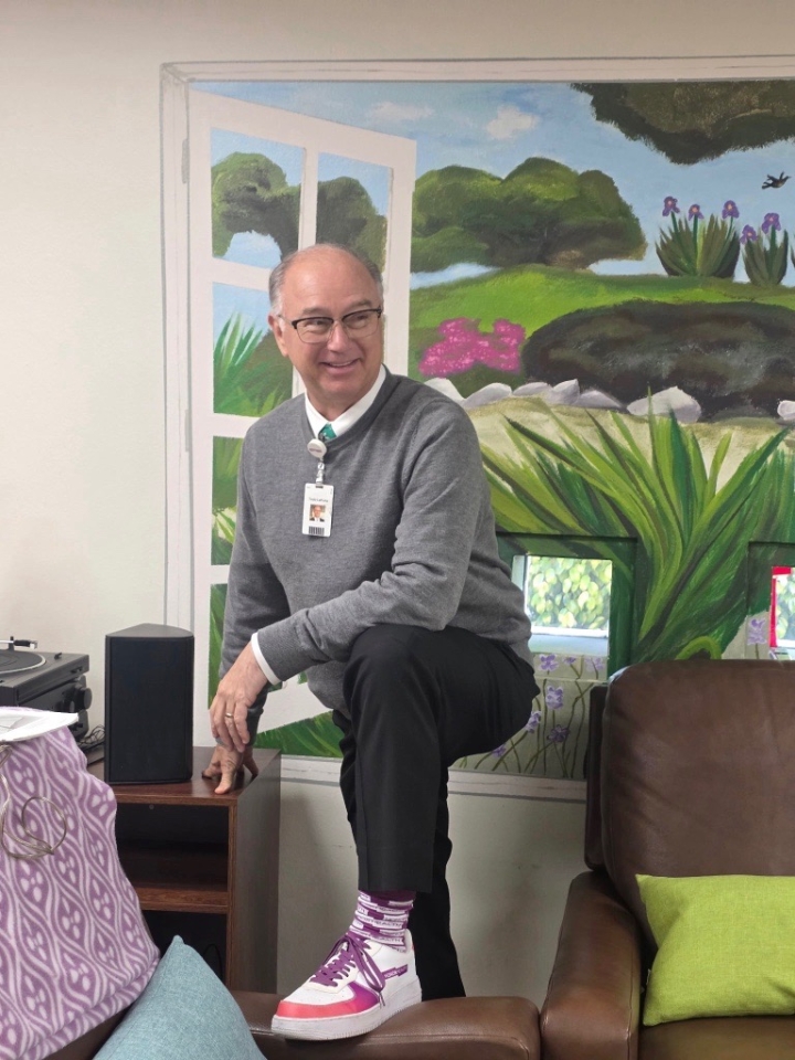 HonorHealth CEO Todd LaPorte poses for silly photo in new Nike shoes.