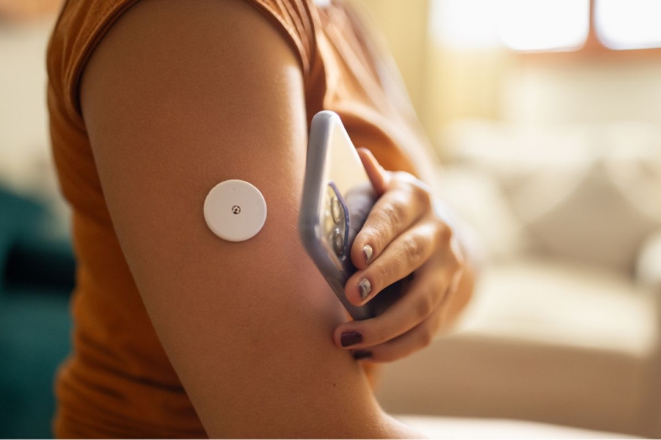HonorHealth Whole Health Institute - Diabetic woman's arm is shown with Continuous Glucose Monitor (CGM).