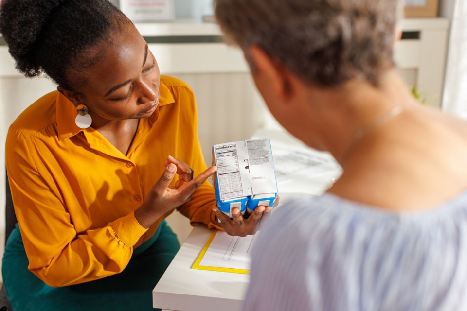 HonorHealth Whole Health Institute - Nutrition coach shows patient how to interpret food labels and make healthier food choices.