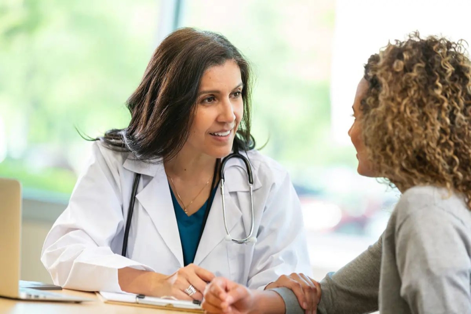 HonorHealth Whole Health Institute - Family and Integrative Medicine provider, Shalini Singh-Karnik, MD, talks with patient during visit.