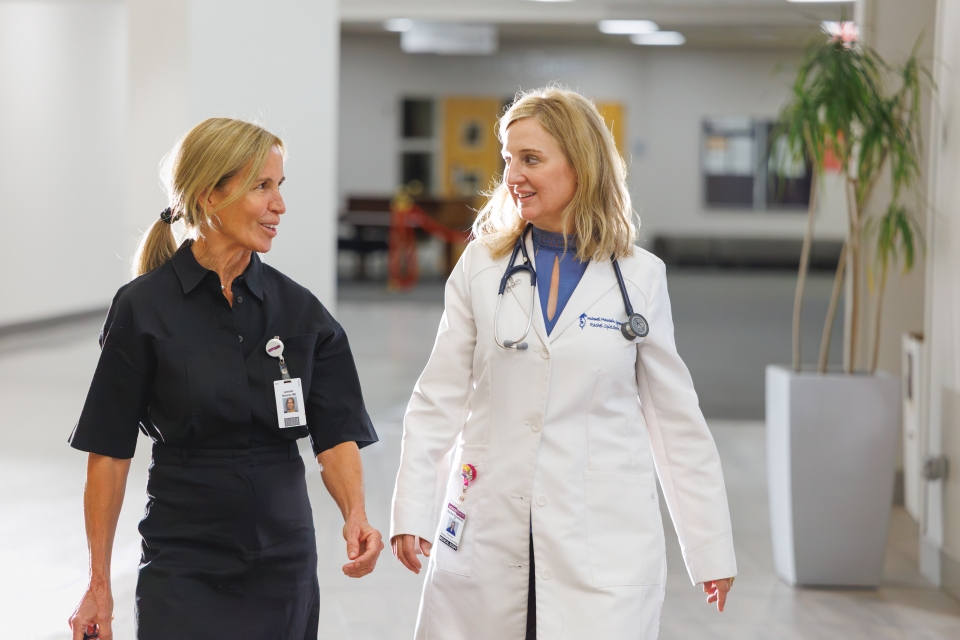 HonorHealth Fibroid Specialty Care - Gynecologist, Rachel Spieldoch, MD, and physician walk together in office.