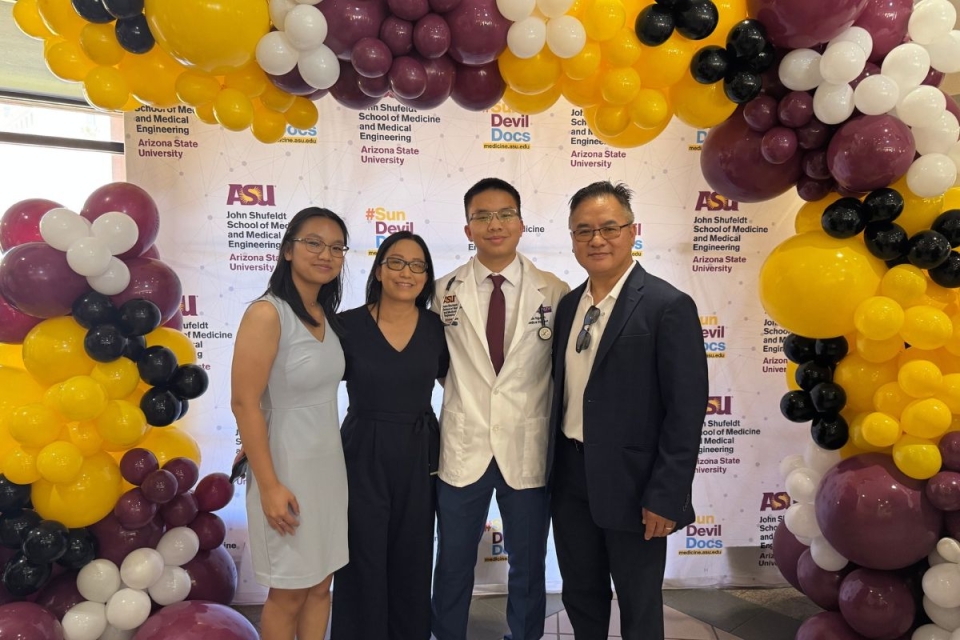 HonorHealth volunteer Dustin Nguyen poses for photo with family while celebrating his admittance to ASU’s John Shufeldt School of Medicine and Medical Engineering at age 19.