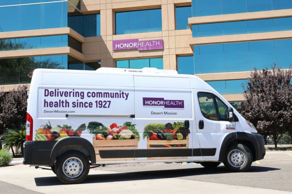 HonorHealth Desert Mission community van that says, "Delivering community health since 1927."