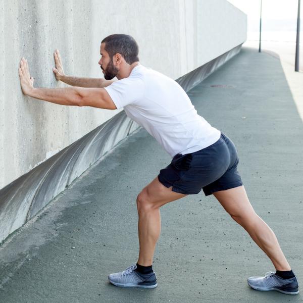 An HonorHealth patient doing a straight knee calf stretch