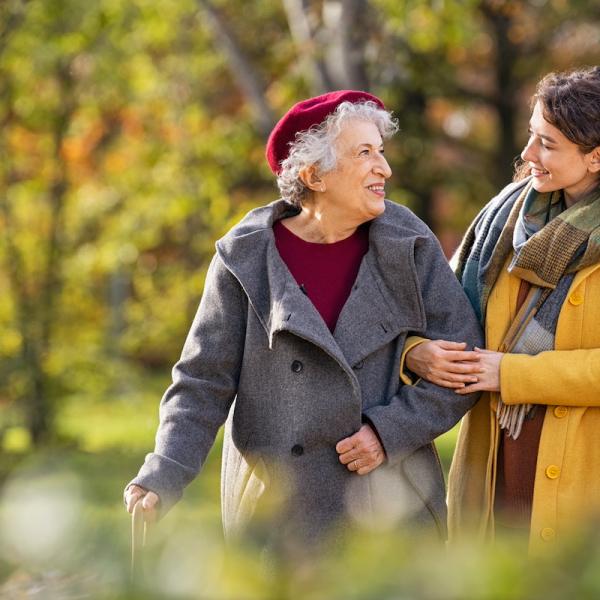A patient walks with a family member