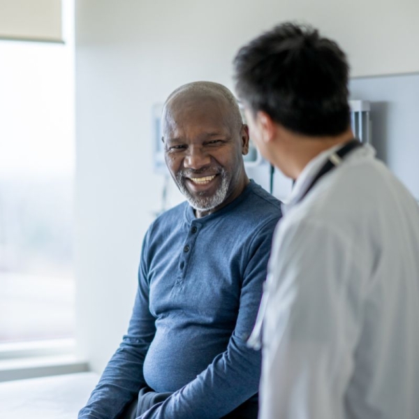 After using HonorHealth’s open access model, a smiling patient sits with a trusted provider at a scheduled appointment for the same or next day.  