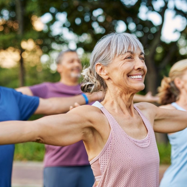 Smiling women of older age reduce their risk of stroke by exercising in the park.