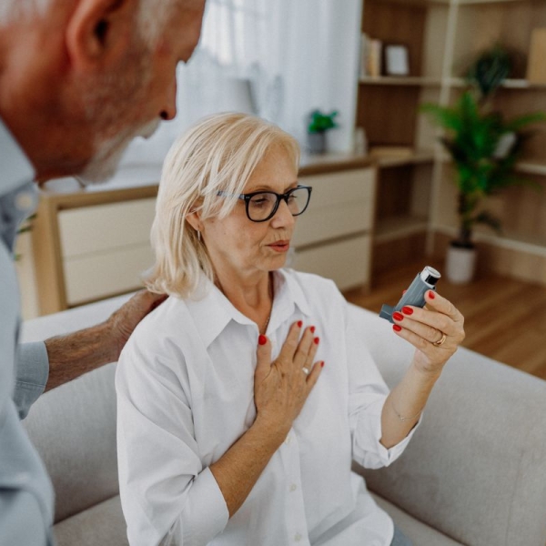 HonorHealth Heart Care - Woman with asthma and COPD uses inhaler for shortness of breath due to poor air quality in the summer.