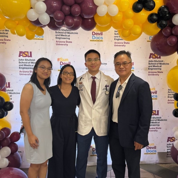 HonorHealth volunteer Dustin Nguyen poses for photo with family while celebrating his admittance to ASU’s John Shufeldt School of Medicine and Medical Engineering at age 19.