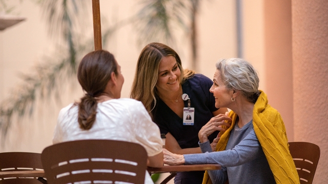 HonorHealth - Nurse caring for a patient. Honor is quality care.