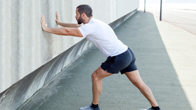 An HonorHealth patient doing a straight knee calf stretch