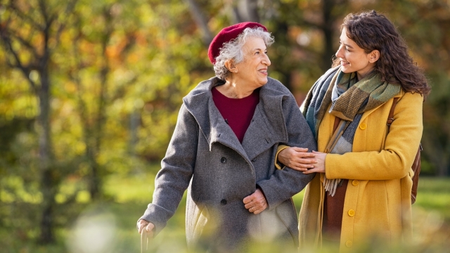 A patient walks with a family member
