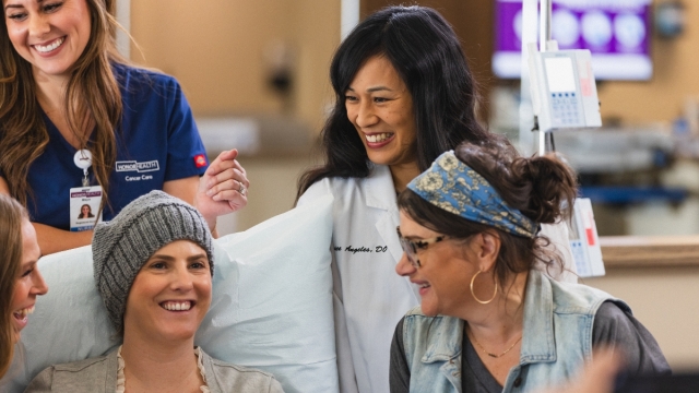 HonorHealth Cancer Care - Gynecologic cancer patient and HonorHealth staff smiles in group photo.