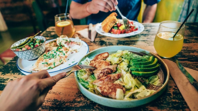 HonorHealth Bariatrics - Two people sit at a table with various protein sources 