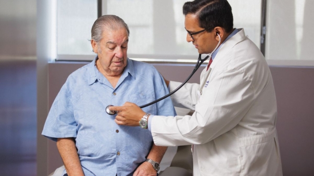 HonorHealth Heart Care - Doctor listens to male patient's heart.