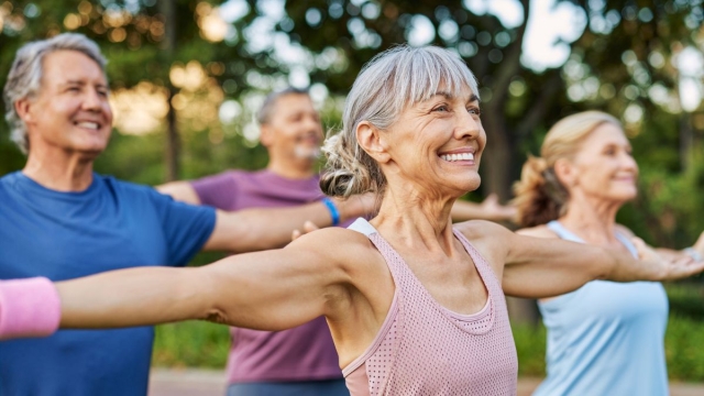 HonorHealth Neurology - Smiling women of older age in the park reduce their risk of stroke by exercising.