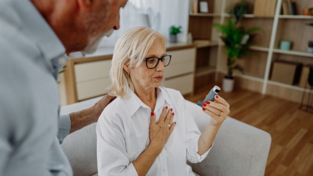 HonorHealth Heart Care - Woman with asthma and COPD uses inhaler for shortness of breath due to poor air quality in the summer.